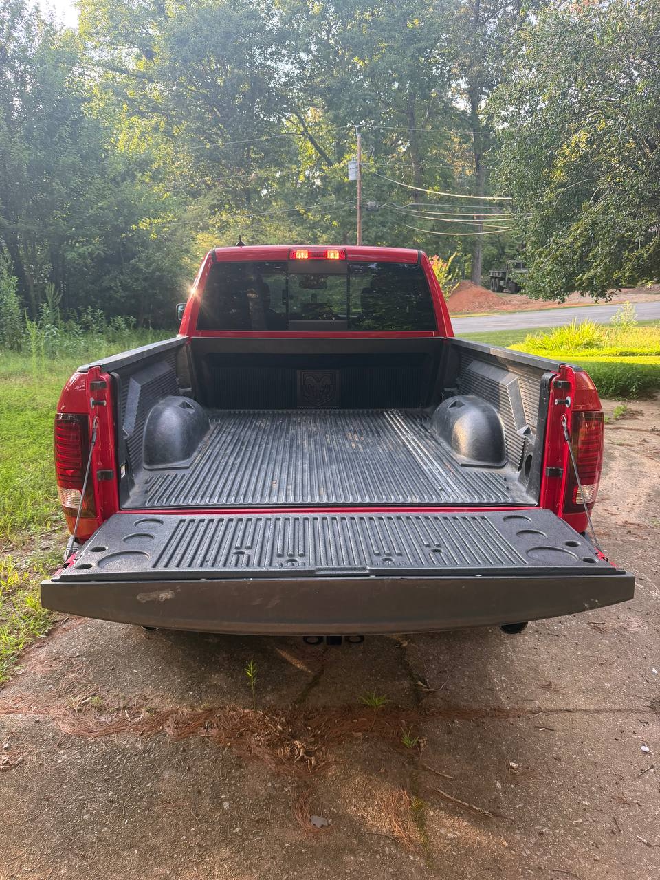 Empty GrabMyJunk truck bed before a furniture pickup